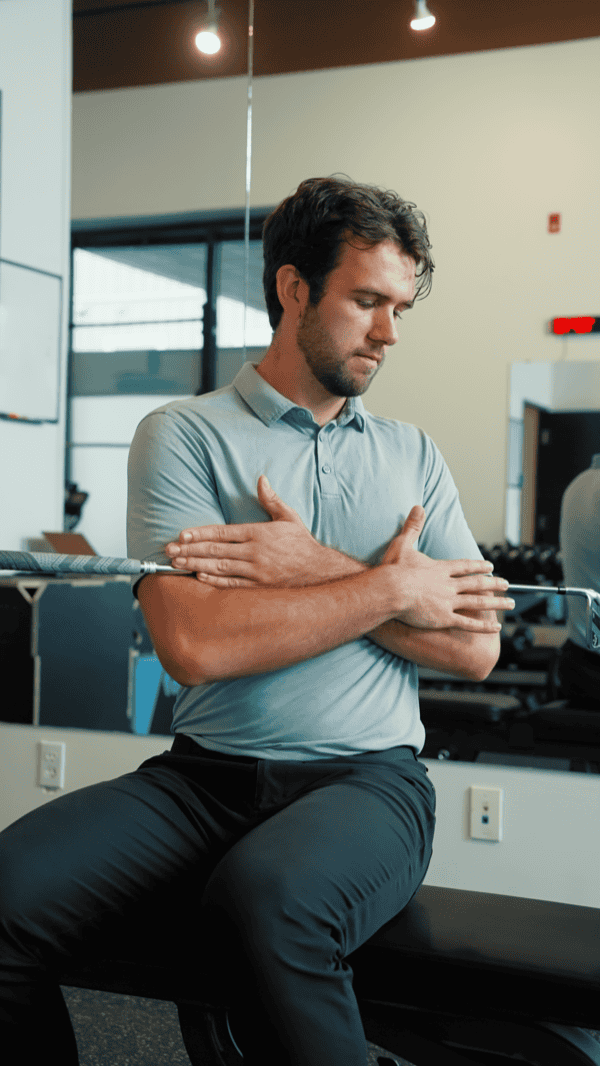 Male physiotherapist evaluating patient in a modern clinic setting.