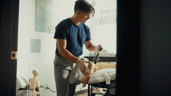 Physiotherapist performing leg therapy at South Island Physiotherapy.