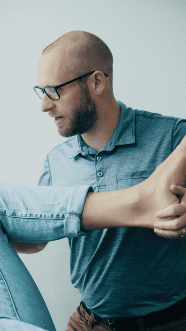 Physiotherapist assisting patient during therapy session at South Island Physiotherapy.